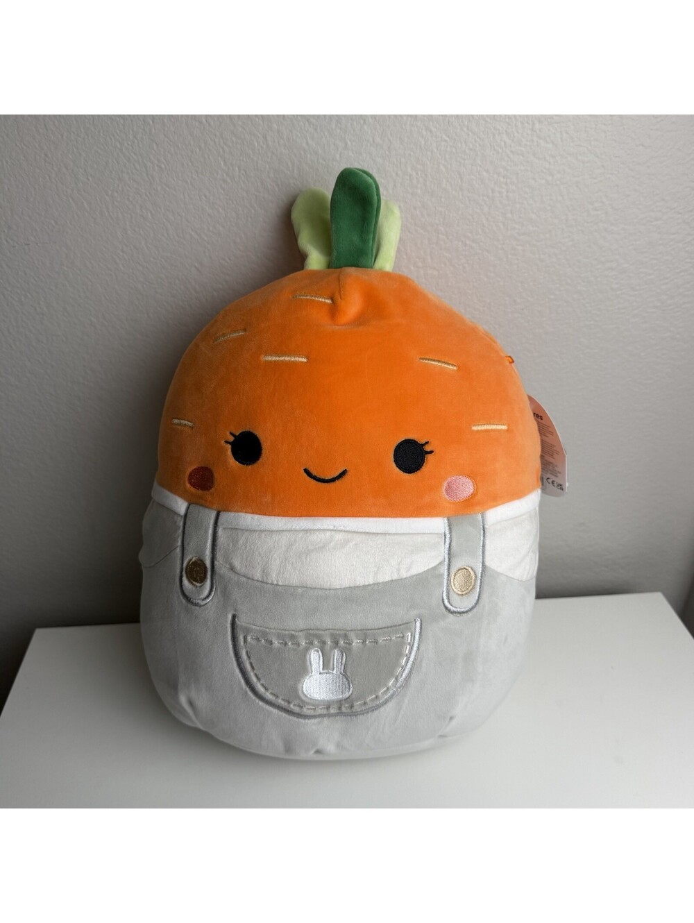 Squishmallows Caroleena Carrot in Gray Overalls with Bunny Pocket, 12"